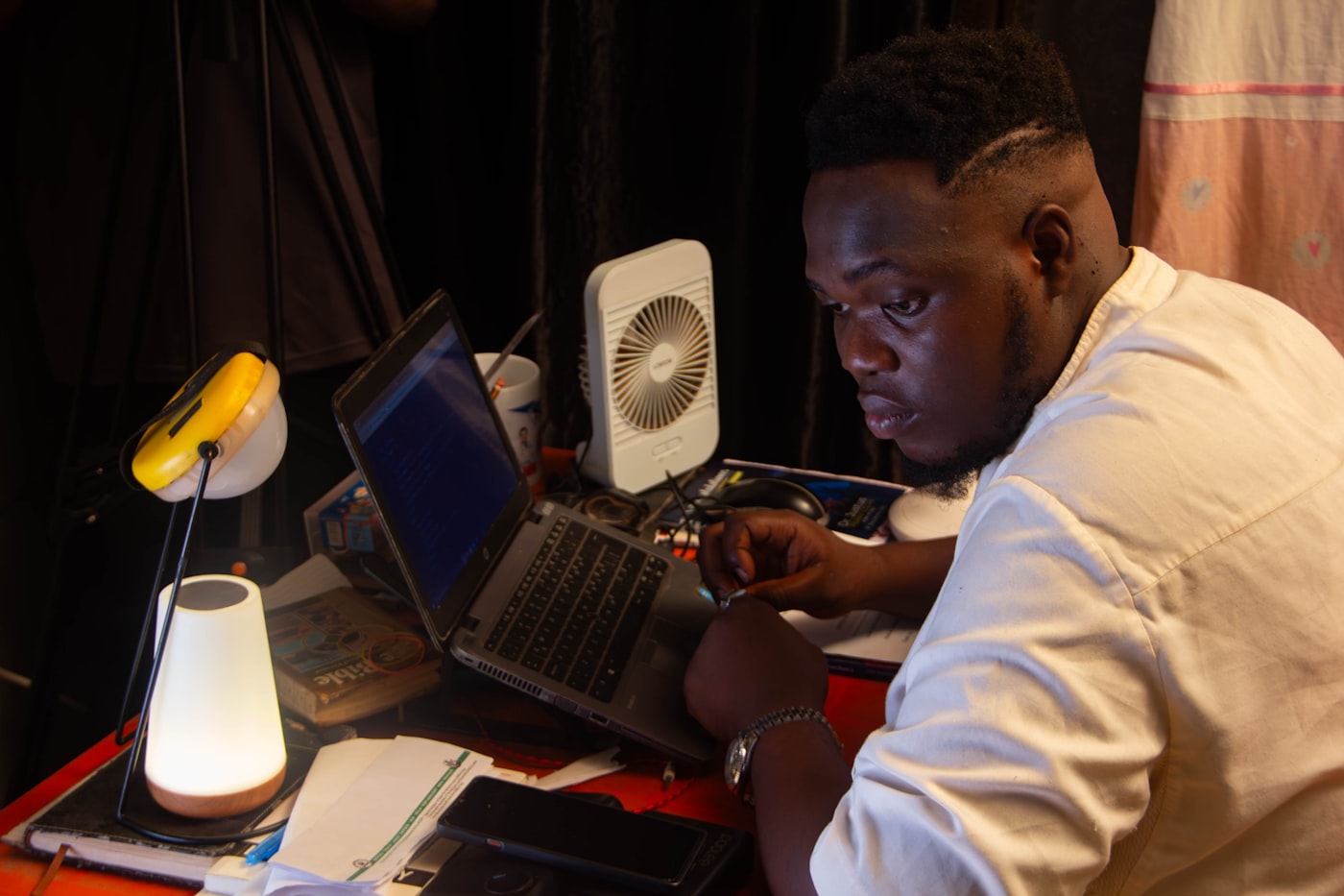Working late at a desk on a laptop