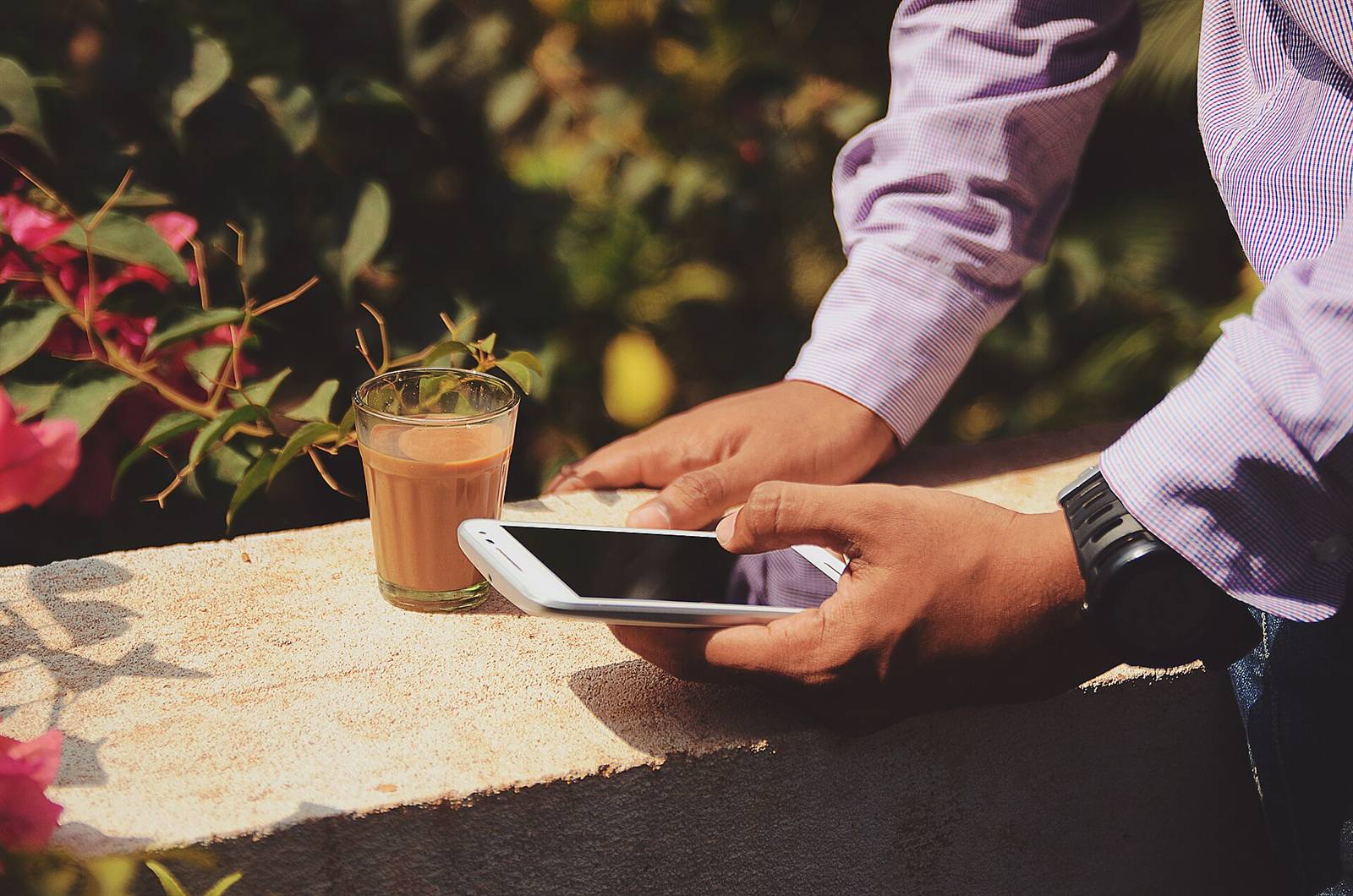 A customer paying on a phone at a table